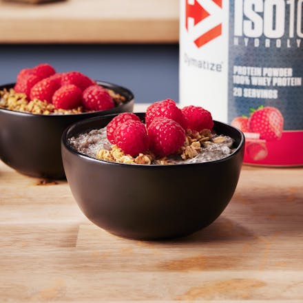 Berry High Protein & Fiber Chia Yogurt Bowls with a tub of Dymatize ISO100 Strawberry Protein Powder